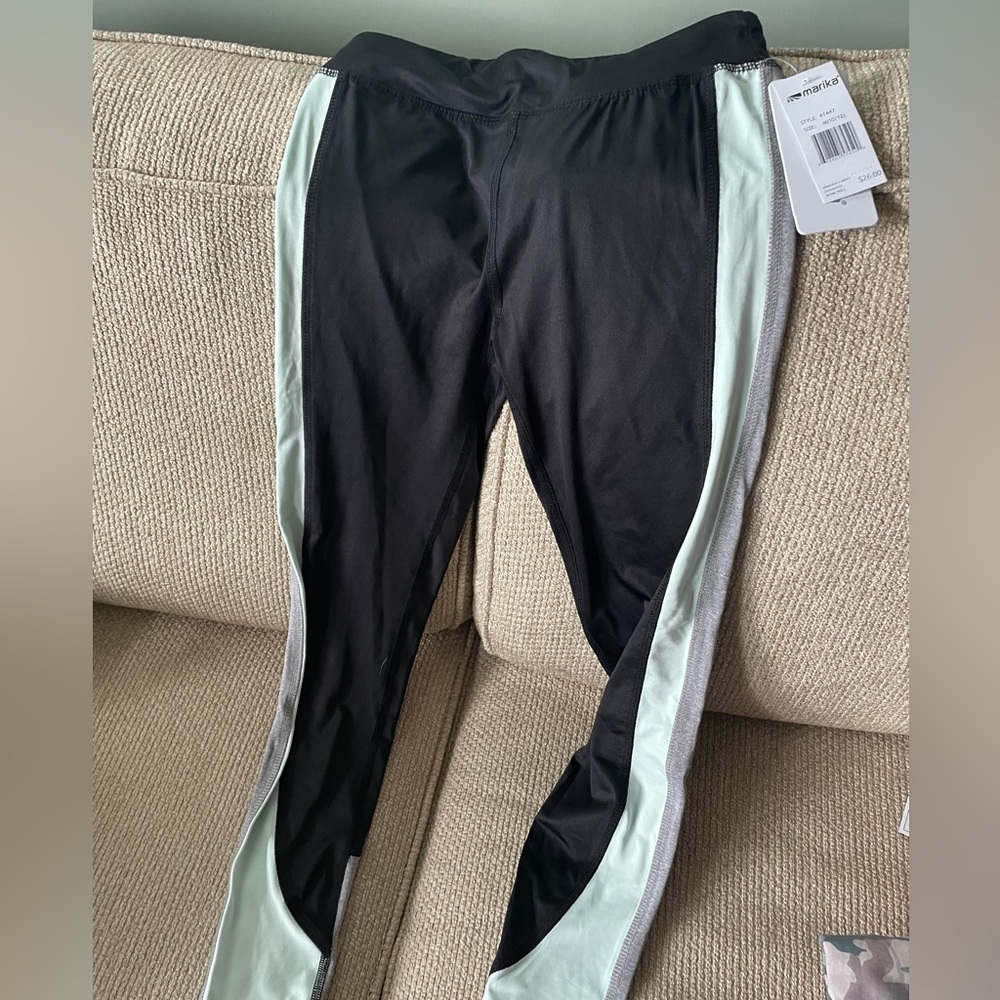 Marika leggings Size 10/12 Black with mint green and gray stripe down each side